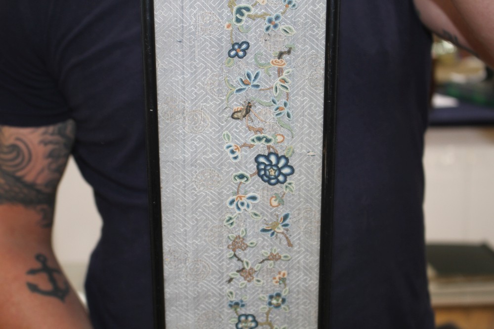 A Chinese silkwork double sleeve panel, 77 x 18cm overall, a smaller floral panel, 61 x 11cm and another, 34 x 26cm overall